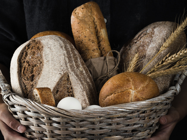 Hands holding bread basket